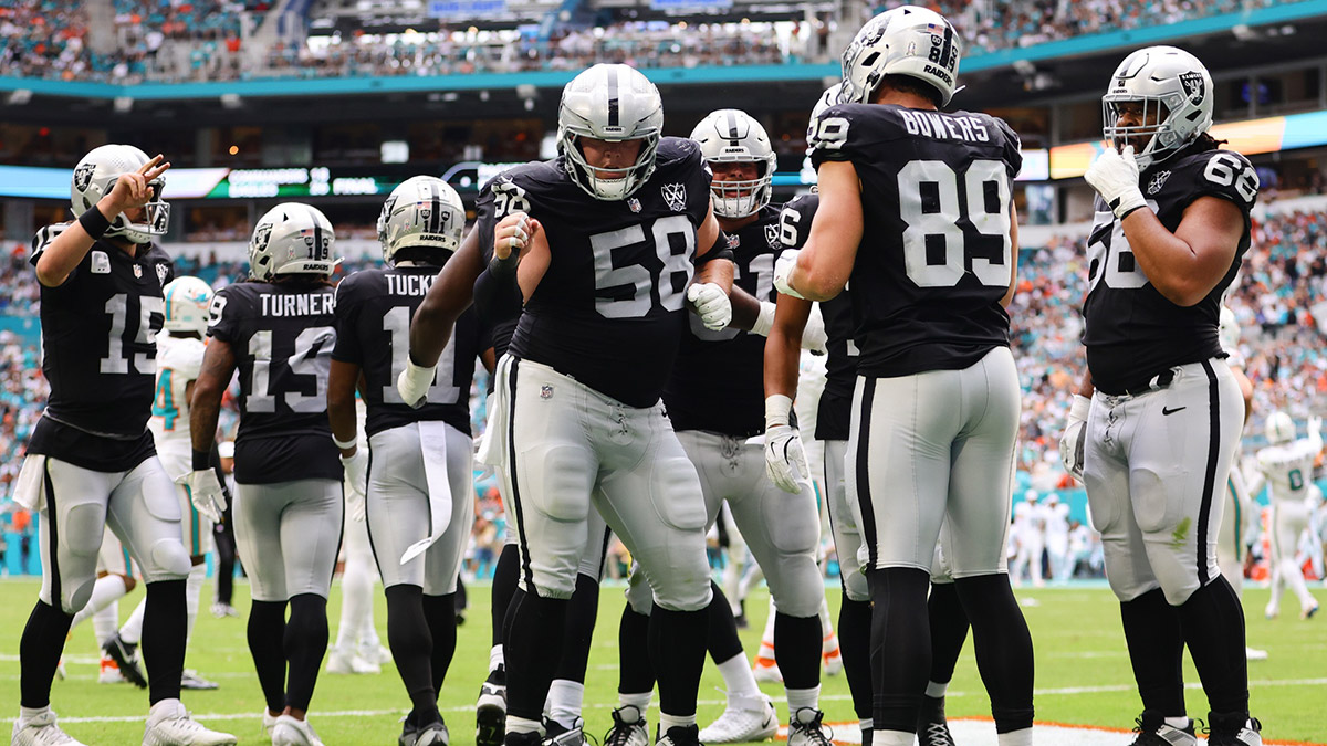 Las Vegas Raiders tight end Brock Bowers (89) celebrates with guard Jackson Powers-Johnson (58) after scoring a touchdown against the Miami Dolphins during the third quarter at Hard Rock Stadium