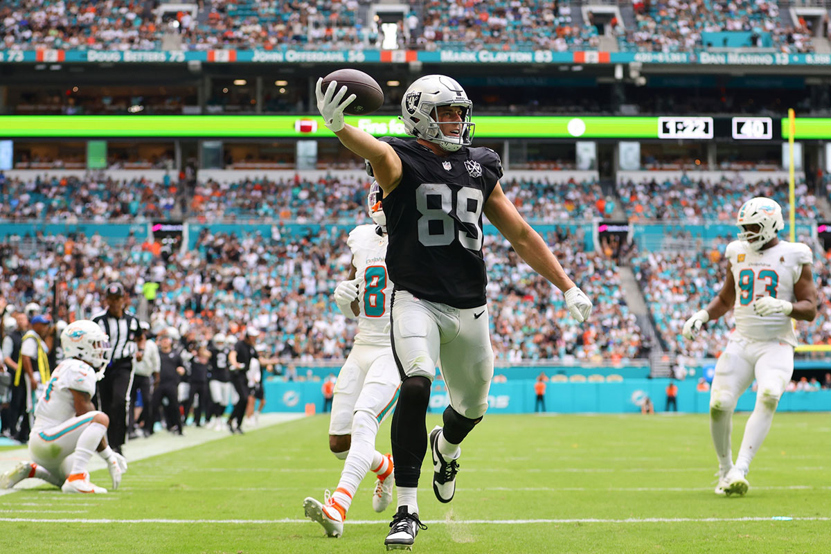 Las Vegas Raiders tight end Brock Bowers (89) runs with the football for a touchdown against the Miami Dolphins during the third quarter at Hard Rock Stadium. 