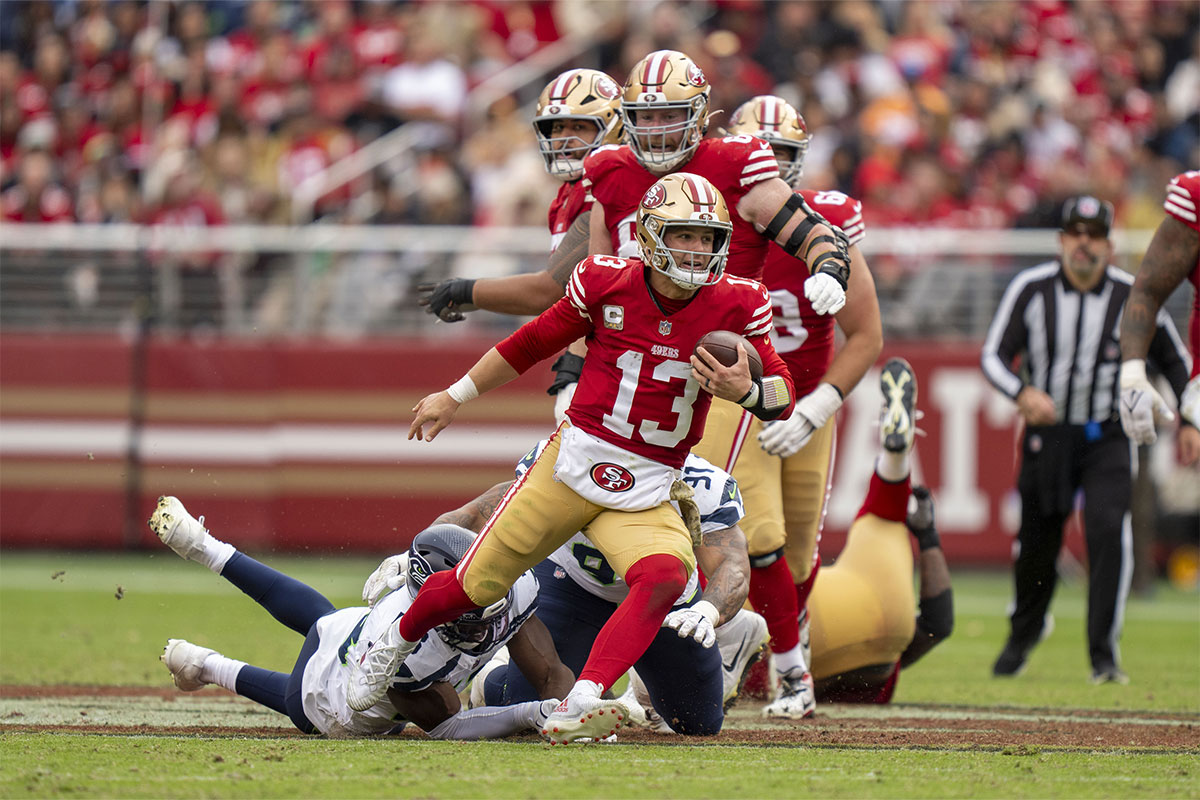 San Francisco 49ers quarterback Brock Purdy (13) runs the football against the Seattle Seahawks during the third quarter at Levi's Stadium. 