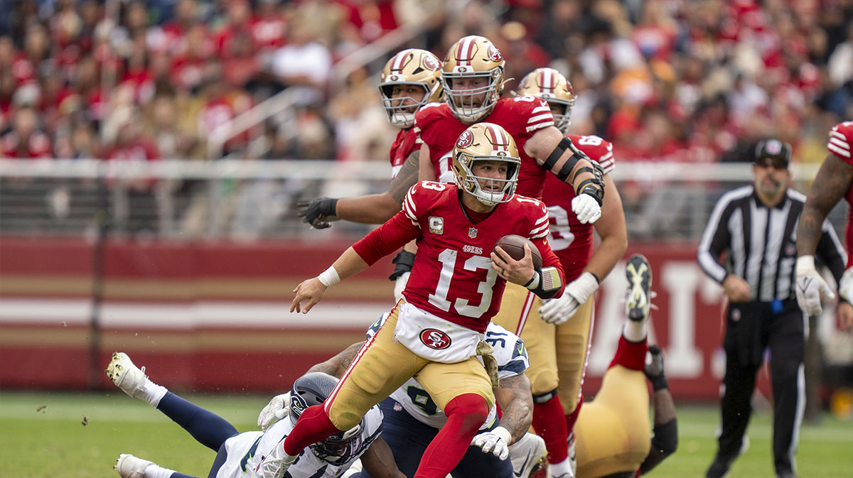 San Francisco 49ers quarterback Brock Purdy (13) runs the football against the Seattle Seahawks during the third quarter at Levi's Stadium. 