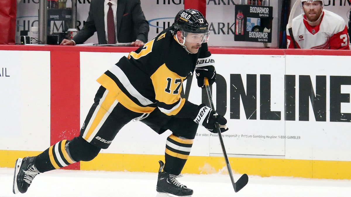 Pittsburgh Penguins right wing Bryan Rust (17) skates up ice with the puck against the Detroit Red Wings during the first period at PPG Paints Arena.