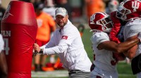 Indiana University Defensive Coordinator Bryant Haines instructs players during fall practice at the Mellencamp Pavilion at Indiana University on Friday, Aug. 16, 2024.