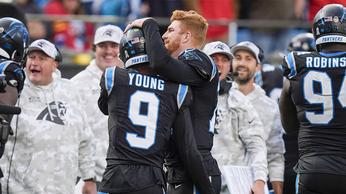 Carolina Panthers quarterback Bryce Young (9) is congratulated by quarterback Andy Dalton (14) after his touchdown drive against the Kansas City Chiefs during the second half at Bank of America Stadium.