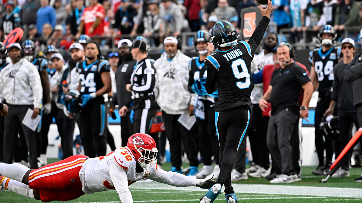 Carolina Panthers quarterback Bryce Young (9) passes the ball as Kansas City Chiefs defensive tackle Tershawn Wharton (98) pressures in the fourth quarter at Bank of America Stadium.