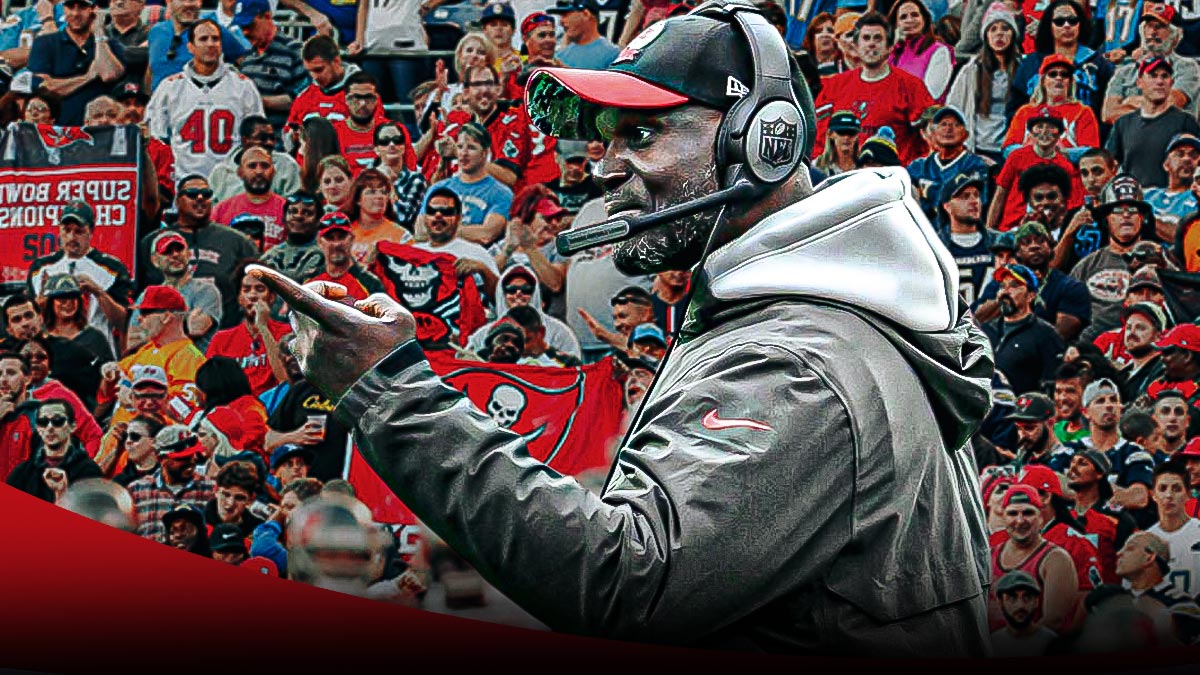 Tampa Bay Buccaneers head coach Todd Bowles looking upset and/or yelling in center, upset and/or annoyed Buccaneers fans on each side of him, Raymond James Stadium (home stadium of the Tampa Bay Buccaneers) in background
