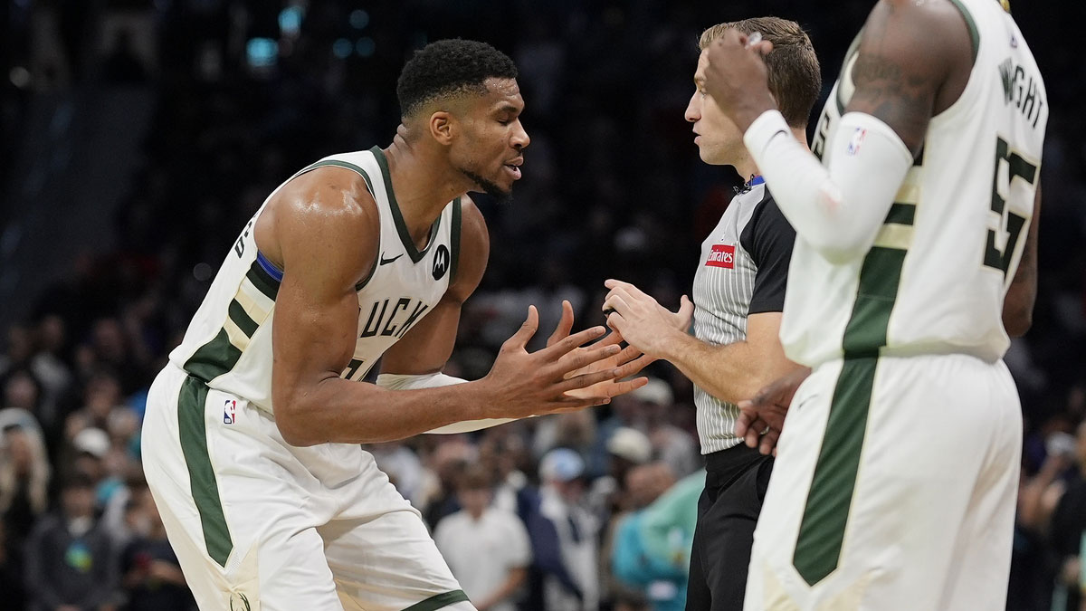 Milwaukee Bucks forward Giannis Antetokounmpo (34) argues a call with referee Brandon Schwab (86) during the second half against the Charlotte Hornets at Spectrum Center. 