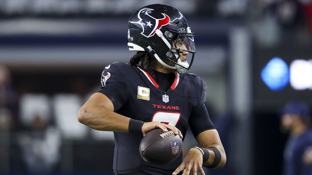 Houston Texans quarterback C.J. Stroud (7) warms up before the game against the Dallas Cowboys at AT&T Stadium