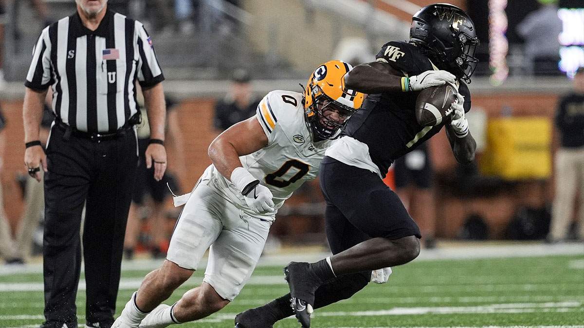Nov 8, 2024; Winston-Salem, North Carolina, USA; California Golden Bears linebacker Cade Uluave (0) chases down Wake Forest Demon Deacons running back Demond Claiborne (1) during the first half at Allegacy Federal Credit Union Stadium.