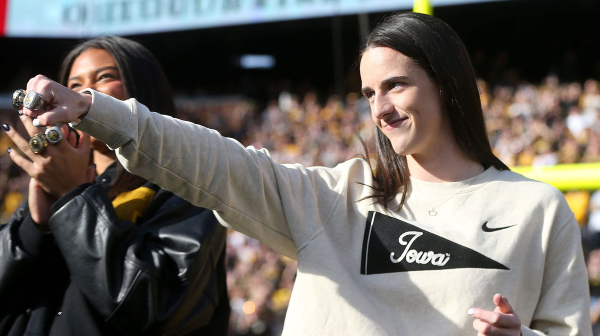 Iowa women’s basketball’s Caitlin Clark shows off her rings during a second quarter timeout during Iowa football’s game against Northwestern Saturday, Oct. 26, 2024 at Kinnick Stadium in Iowa City, Iowa.