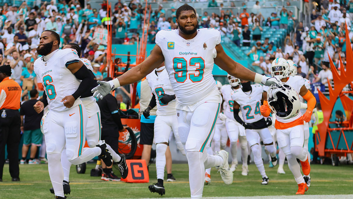 November 24, 2024; Miami Gardens, Florida, USA; Miami Dolphins defensive tackle Calais Campbell (93) runs onto the field before the game against the New England Patriots at Hard Rock Stadium. 