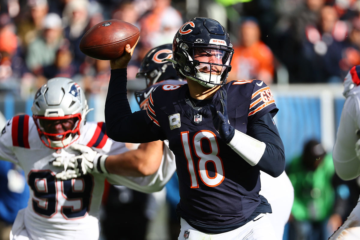 Chicago Bears quarterback Caleb Williams (18) drops back to pass against the New England Patriots during the second half at Soldier Field.