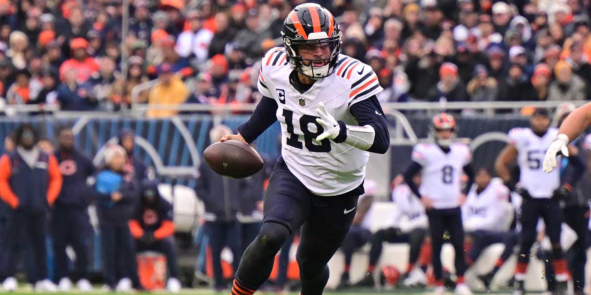Chicago Bears quarterback Caleb Williams (18) runs the ball against the Minnesota Vikings during the fourth quarter at Soldier Field.
