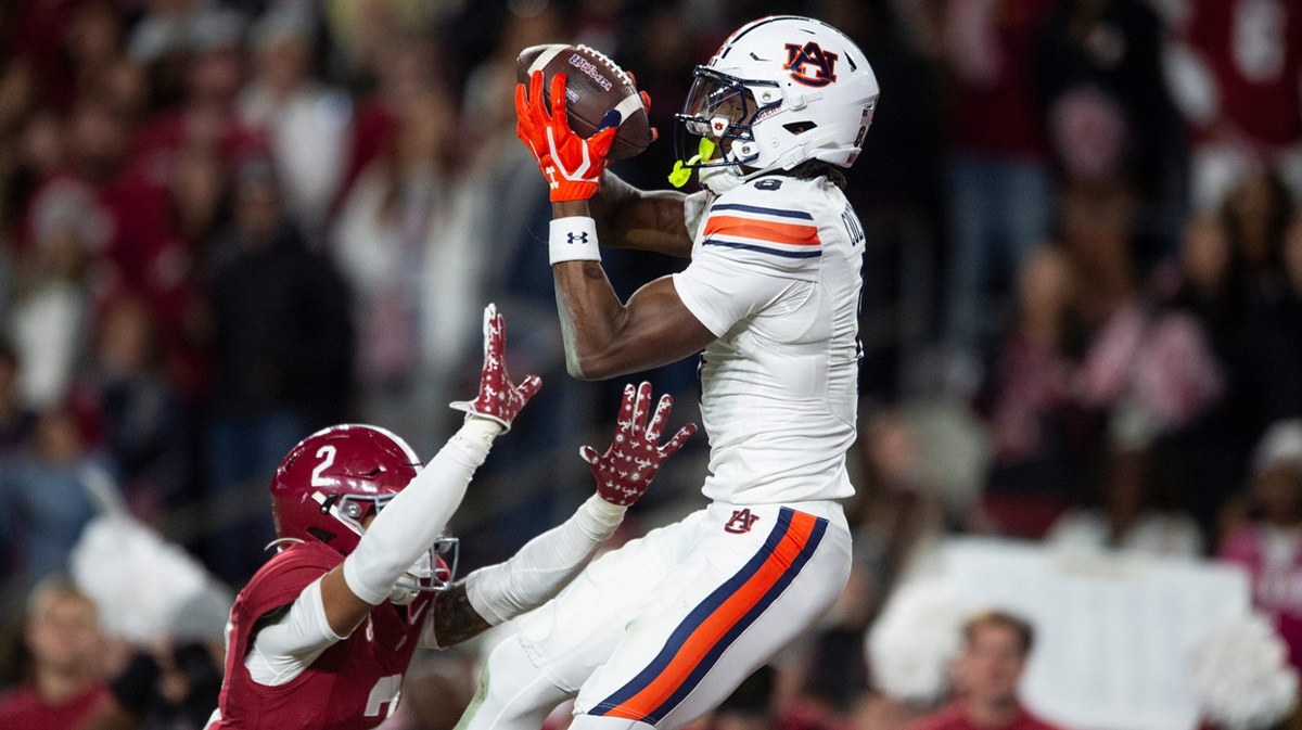 Auburn Tigers wide receiver Cam Coleman (8) catches a touchdown pass over Alabama Crimson Tide defensive back Zabien Brown (2) as Auburn Tigers take on Alabama Crimson Tide at Bryant-Denny Stadium in Tuscaloosa, Ala., on Saturday, Nov. 30, 2024. Alabama Crimson Tide defeated Auburn Tigers 28-14.
