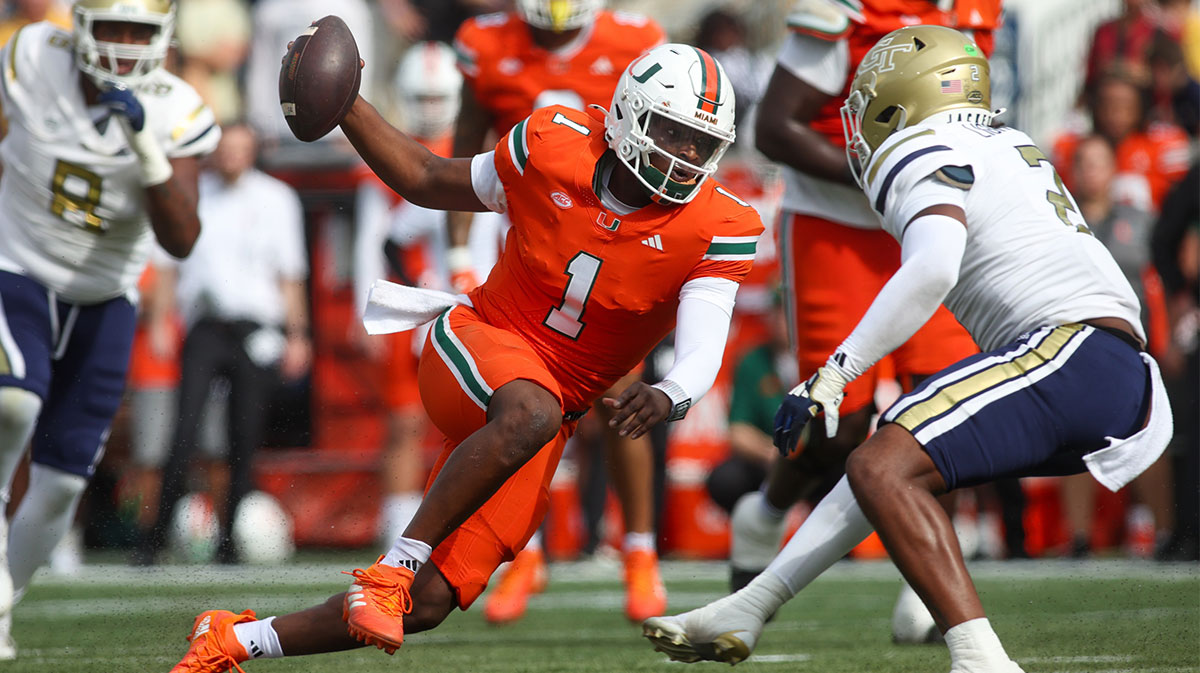 Miami Hurricanes quarterback Cam Ward (1) scrambles against the Georgia Tech Yellow Jackets in the second quarter at Bobby Dodd Stadium at Hyundai Field.
