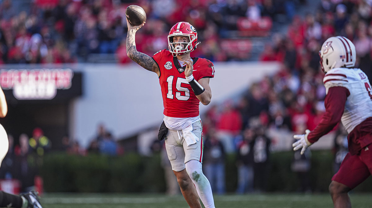 Georgia Bulldogs quarterback Carson Beck (15) passes the ball against the Massachusetts Minutemen during the second half at Sanford Stadium.