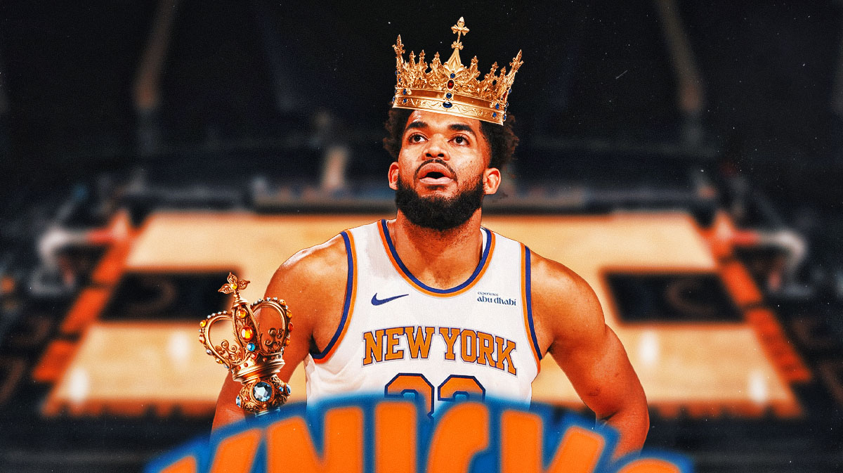 Knicks' Karl-anthony Towns smiling and wearing a crown and holding a scepter.