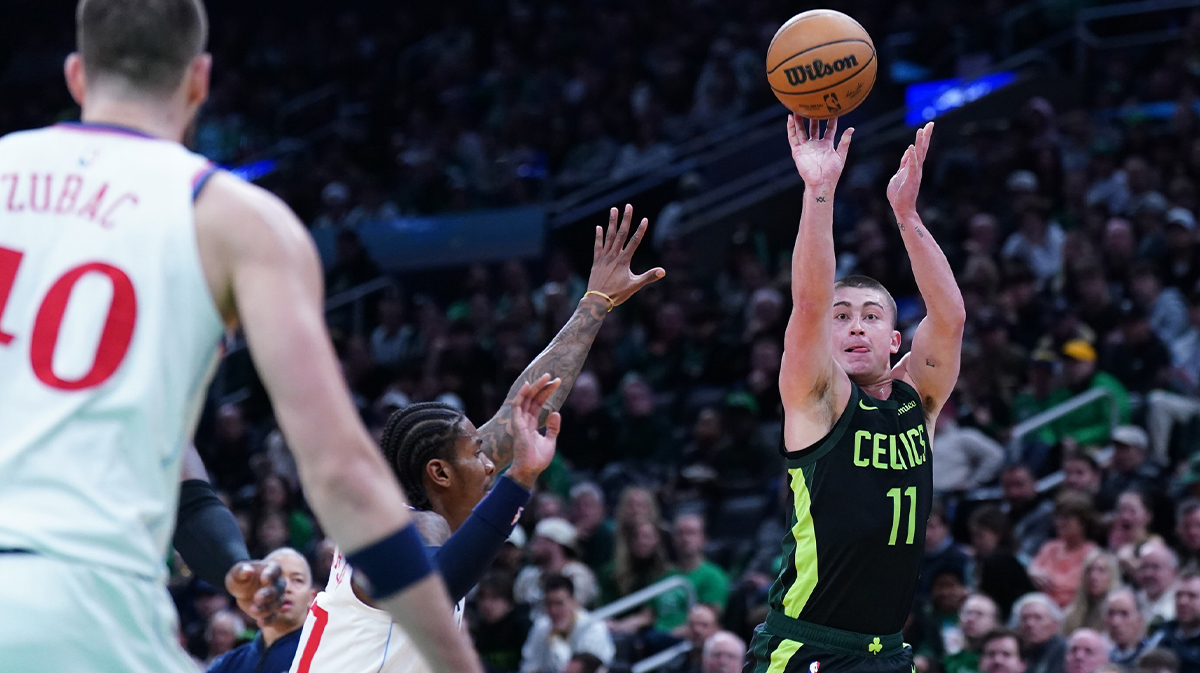 Boston Celtics guard Payton Pritchard (11) shoots for three points against the LA Clippers in the second quarter at TD Garden