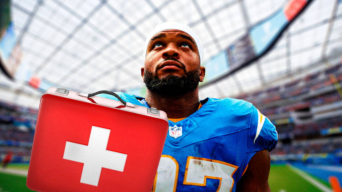 Photo: JK Dobbins in action with medical kit beside him in Chargers jersey
