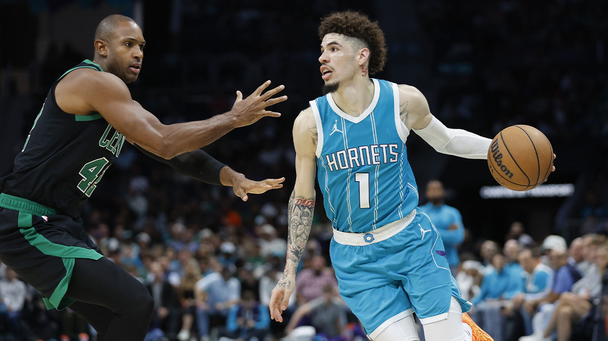 Charlotte Hornets guard LaMelo Ball (1) drives the baseline against Boston Celtics center Al Horford (42) during the second half at Spectrum Center. 