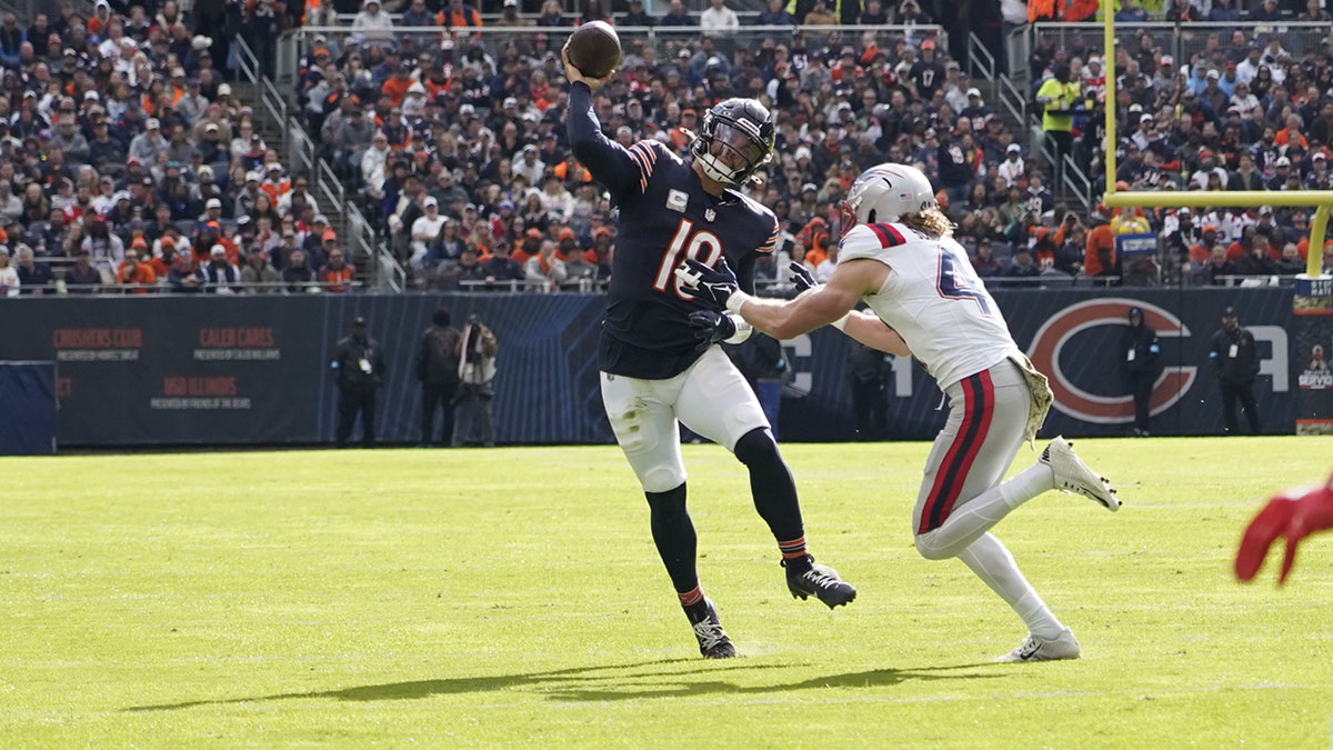Chicago Bears quarterback Caleb Williams (18) passes against the New England Patriots during the first half at Soldier Field.