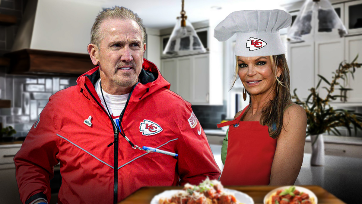 Kansas City Chiefs defensive coordinator Steve Spagnuolo next to his wife Maria Spagnuolo. Maria has a chef's hat on, an apron, and there's a plate of spaghetti and meatballs in front of her.