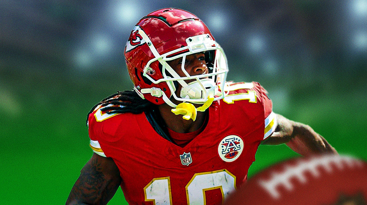 Isiah Pacheco in Chiefs uniform with green light.