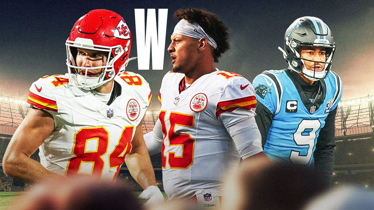 Patrick Mahomes patting Justin Watson on the back. A W in-between them with a sad Bryce young in the background. In Bank of America Stadium