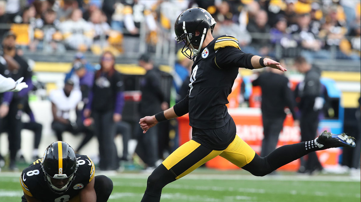 Pittsburgh Steelers place kicker Chris Boswell (9) kicks a field goal from the hold of punter Corliss Waitman (8) against the Baltimore Ravens during the third quarter at Acrisure Stadium. 