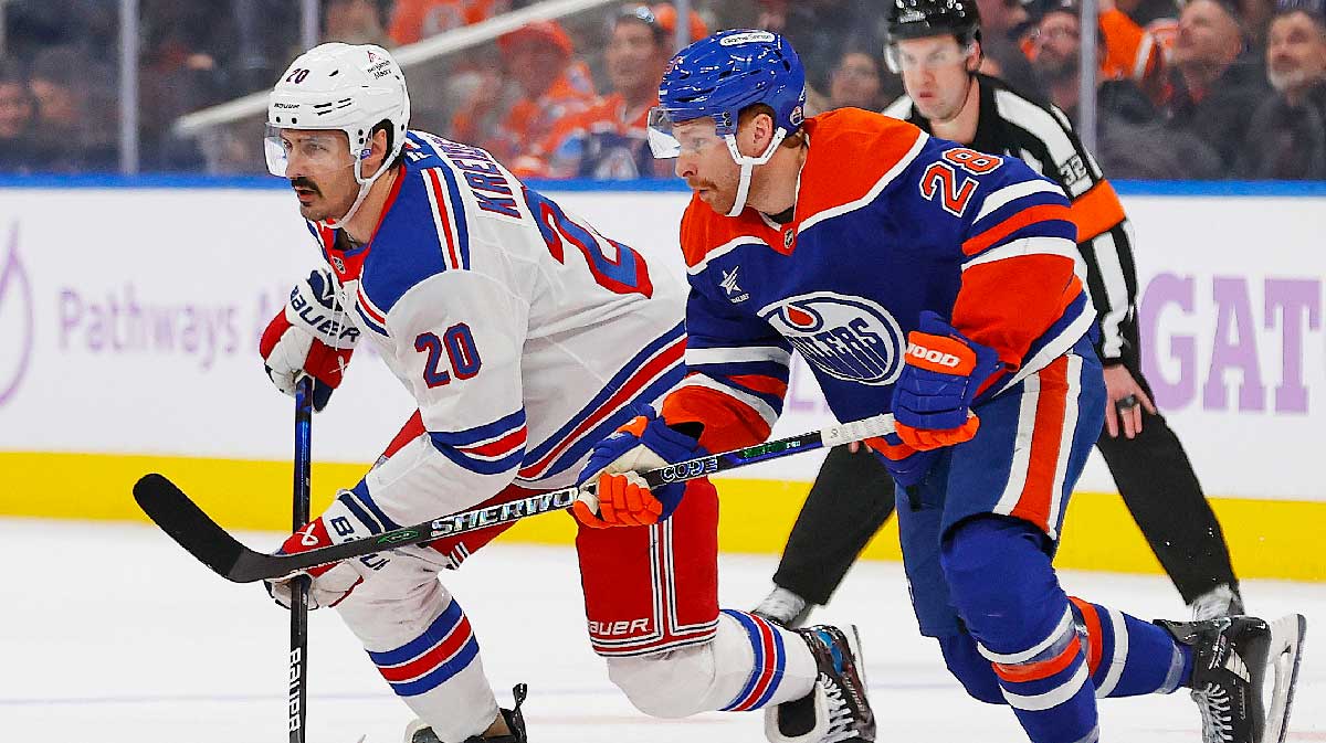Edmonton Oilers forward Connor Brown (28) and New York Rangers forward Chris Kreider (20) chase a loose puck during the second period at Rogers Place.