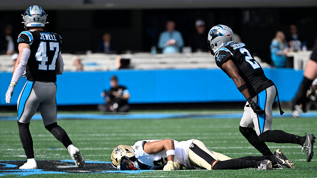 New Orleans Saints wide receiver Chris Olave (12) on the ground after a missed pass attempt as Carolina Panthers linebacker Josey Jewell (47) and cornerback Michael Jackson (2) defend in the first qarter at Bank of America Stadium.