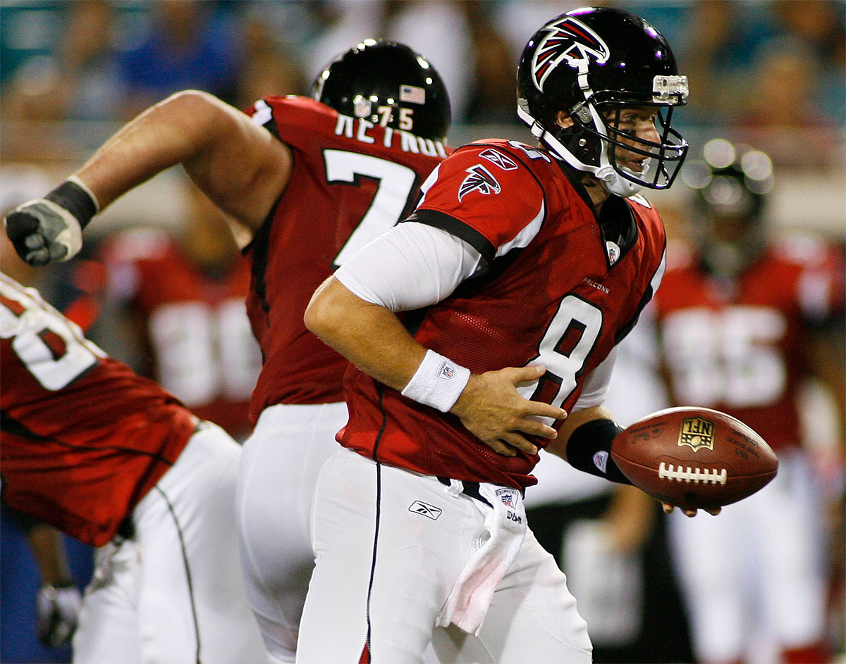 Atlanta Falcons quarterback Chris Redman (8) hands off during the fourth quarter of their game against the Jacksonville Jaguars at EverBank Field. The Jaguars defeated the Falcons 15-13.