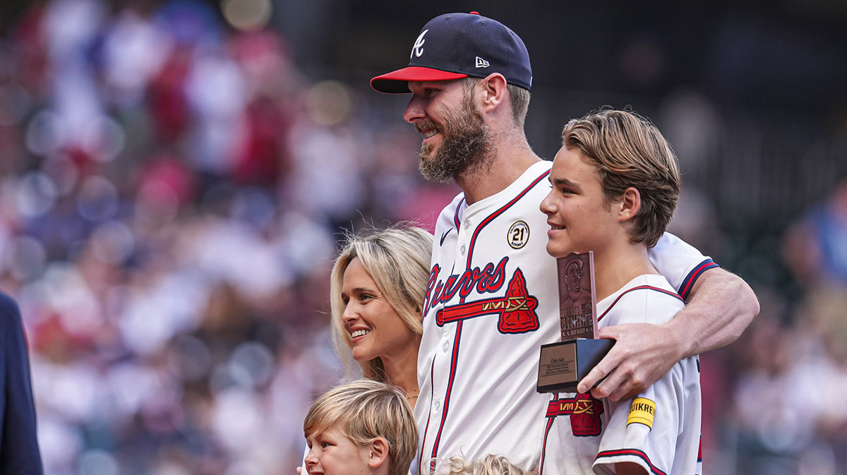 Atlanta Braves pitcher Chris Sale poses with his family upon being named nominee for the Roberto Clemente Award before the game against the Los Angeles Dodgers at Truist Park.