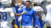 Los Angeles Rams defensive coordinator Chris Shula talks with players during OTAs at the team training facility at California Lutheran University.