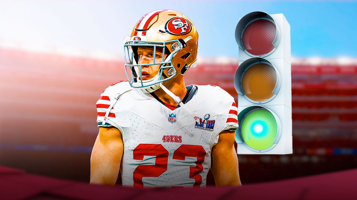 49ers running back christian mccaffrey next to a green light