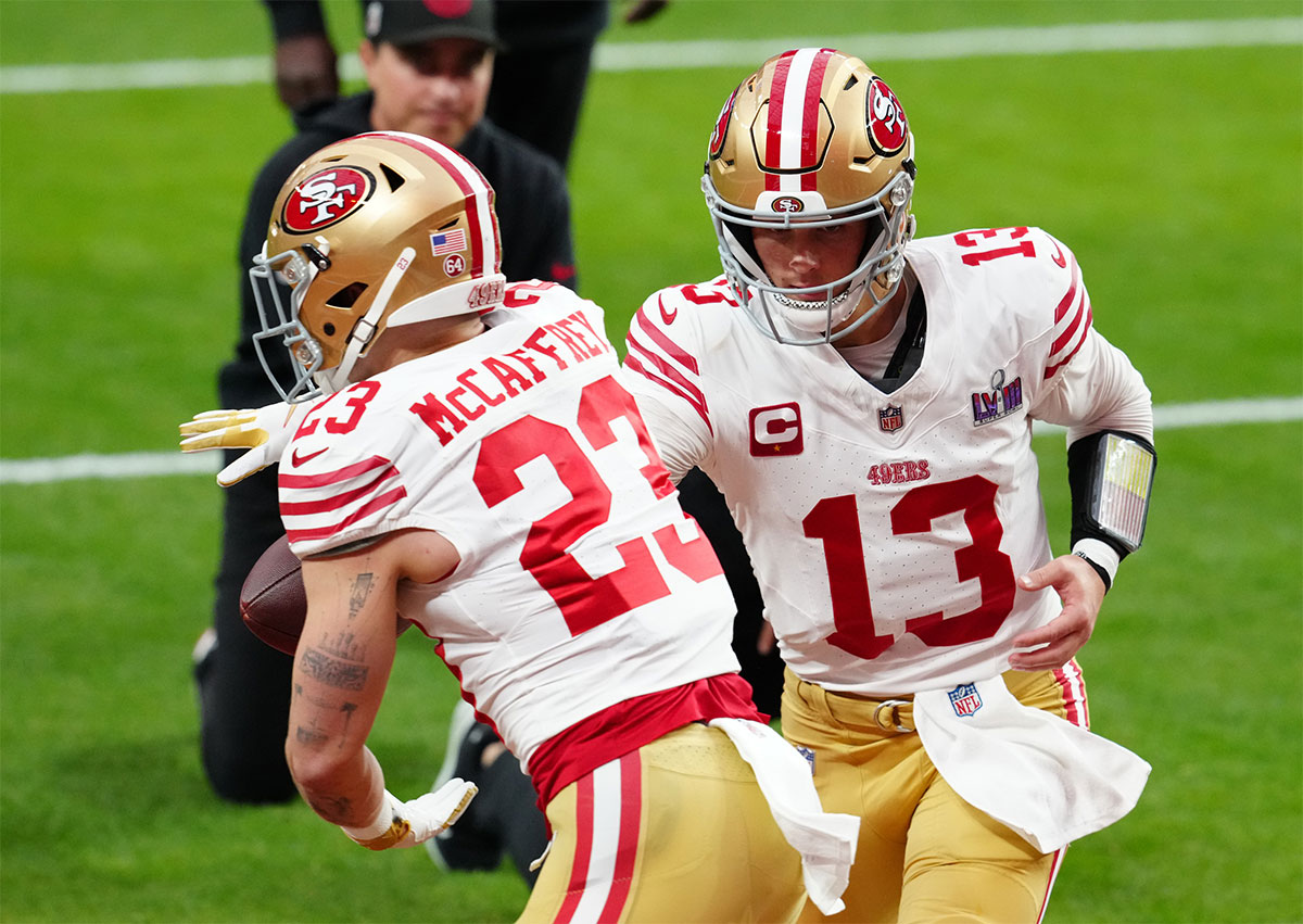 Feb 11, 2024; Paradise, Nevada, USA; San Francisco 49ers quarterback Brock Purdy (13) hands off to San Francisco 49ers running back Christian McCaffrey (23) as they warm up before playing the Kansas City Chiefs in Super Bowl LVIII at Allegiant Stadium.