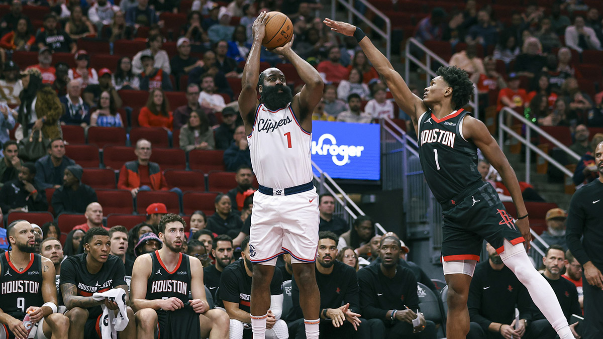 Los Angeles Clippers guard James Harden (1) makes a three-point basket during the second quarter as Houston Rockets forward Amen Thompson (1) defends at Toyota Center. 