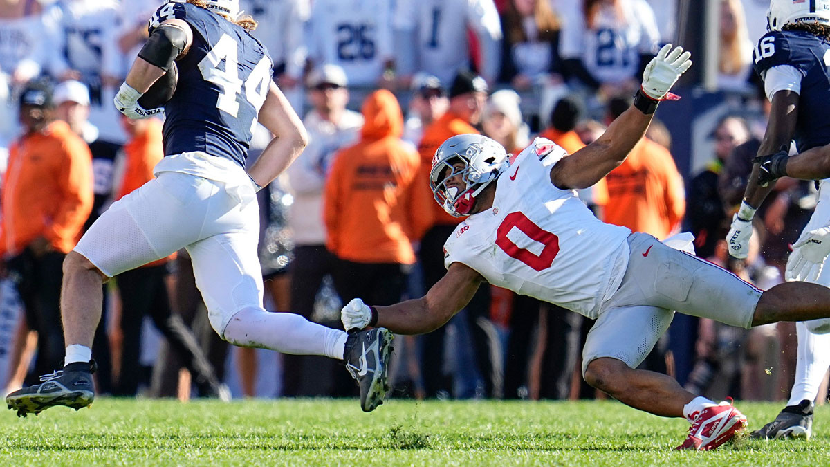 Penn State Nittany Lions tight end Tyler Warren (44) runs around Ohio State Buckeyes linebacker Cody Simon (0) during the second half of an NCAA football game at Beaver Stadium in University Park, Pennsylvania, on Saturday, November 2. 2024. Ohio State won 20-13.