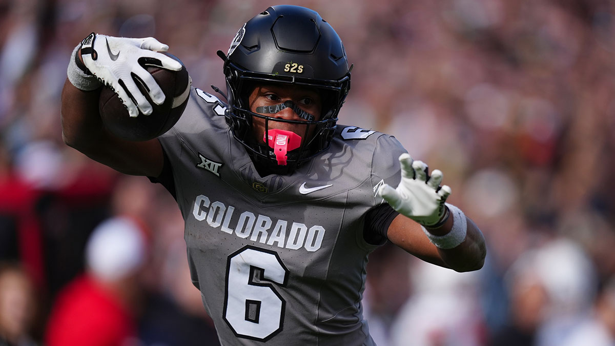 Colorado Buffaloes wide receiver Drelon Miller (6) carries for a touchdown in the fourth quarter against the Utah Utes at Folsom Field.