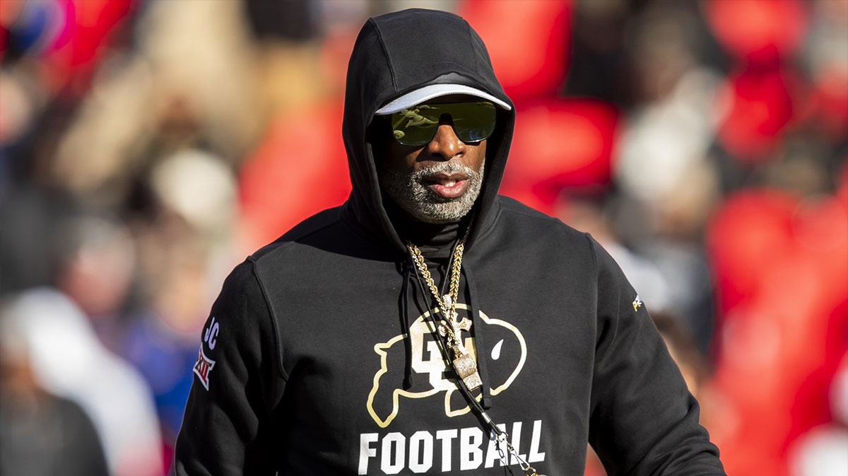 Colorado head coach Deion Sanders watches his players warmup prior to the game between the Kansas Jayhawks and the Colorado Buffaloes at GEHA Field at Arrowhead Stadium