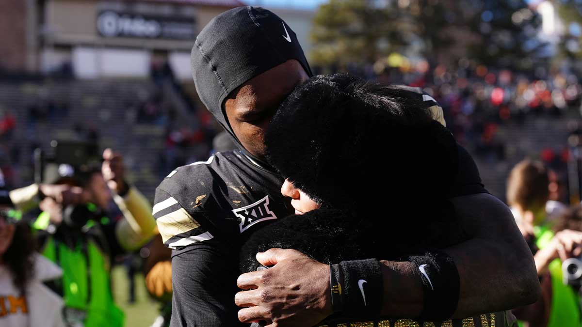 Colorado Buffaloes wide receiver Travis Hunter (12) hugs his girl friend following the win against the Oklahoma State Cowboys at Folsom Field