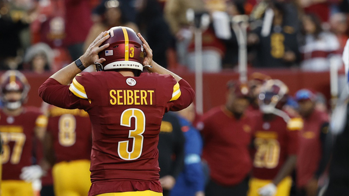 Washington Commanders place kicker Austin Seibert (3) reacts after missing a potential game-tying extra point in the final minute against the Dallas Cowboys during the fourth quarter at Northwest Stadium.