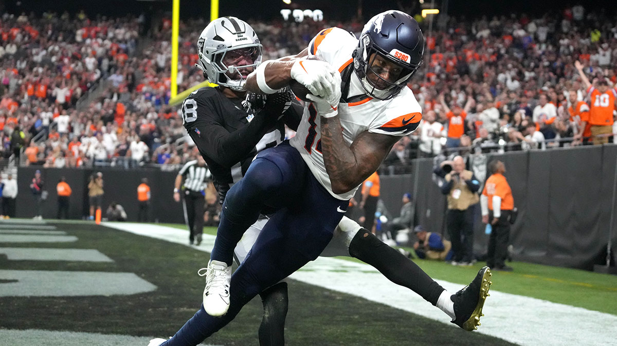 Denver Broncos wide receiver Courtland Sutton (14) catches an 18-yard touchdown pass against Las Vegas Raiders cornerback Jack Jones (18) in the third quarter at Allegiant Stadium.
