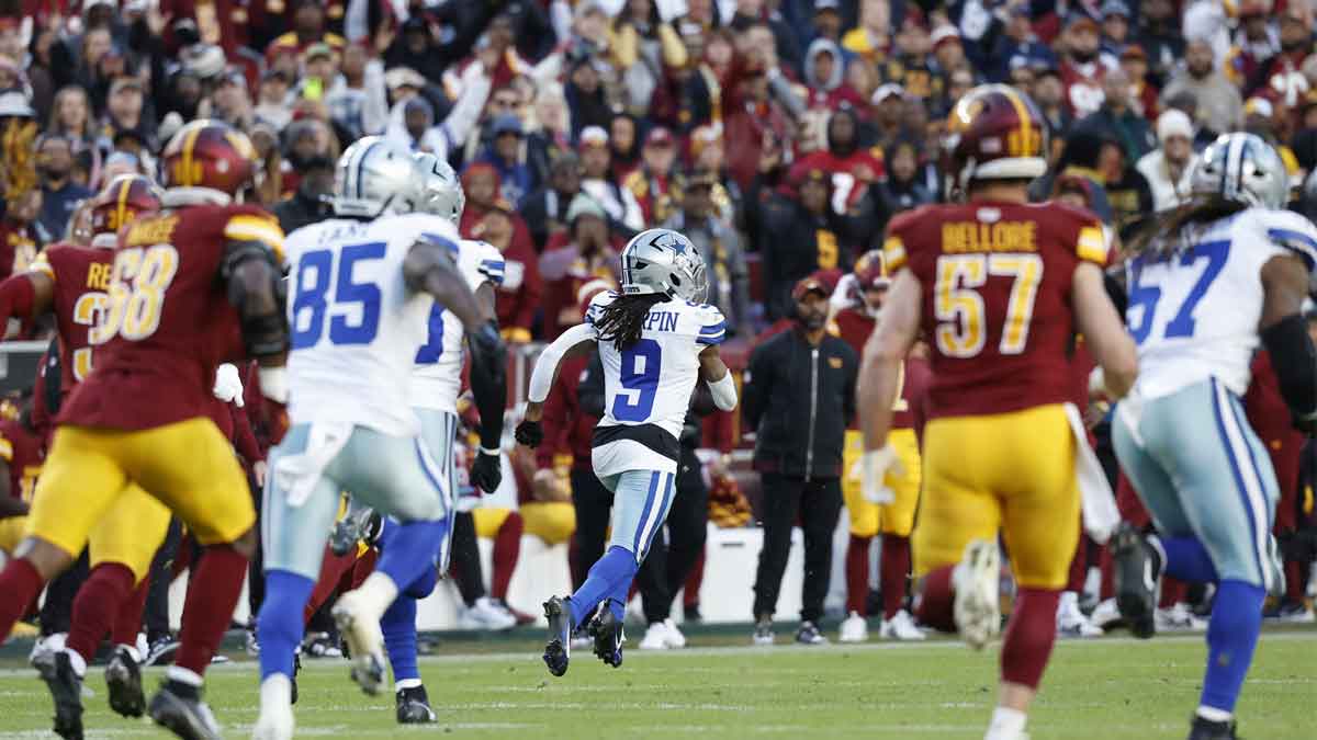 Dallas Cowboys wide receiver KaVontae Turpin (9) returns a kickoff for a touchdown against the Washington Commanders during the fourth quarter at Northwest Stadium. 