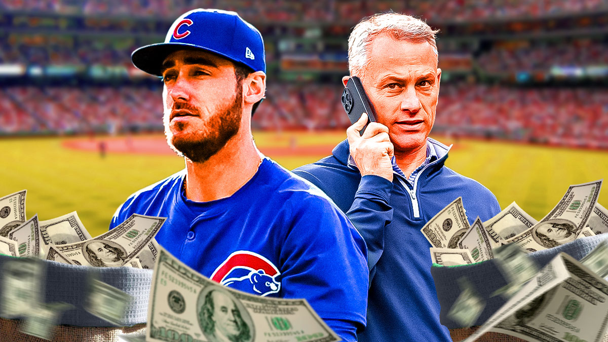 Cubs' Cody Bellinger standing next to Cubs President of Baseball Operations Jed Hoyer and a big sack of money