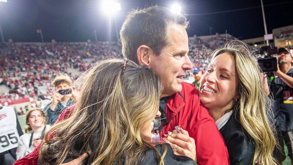 Indiana Head Coach Curt Cignetti gets a hug from his children after the Indiana versus Michigan football game at Memorial Stadium on Friday, Nov. 9, 2024.
