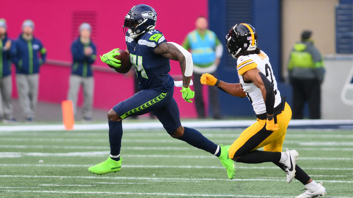 Seattle Seahawks wide receiver DK Metcalf (14) carries the ball after a catch against the Pittsburgh Steelers during the second half at Lumen Field.