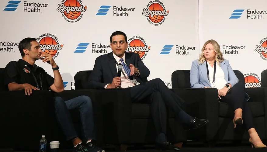 Dr. Ravi Bashyal (blue tie), the co-medical director and head National Basketball Retired Players Association hip and knee consultant, speaks to members and their families about the new partnership between Endeavor Health and the NBRPA. The service provides a 24/7 hotline and access to specialists across the country.