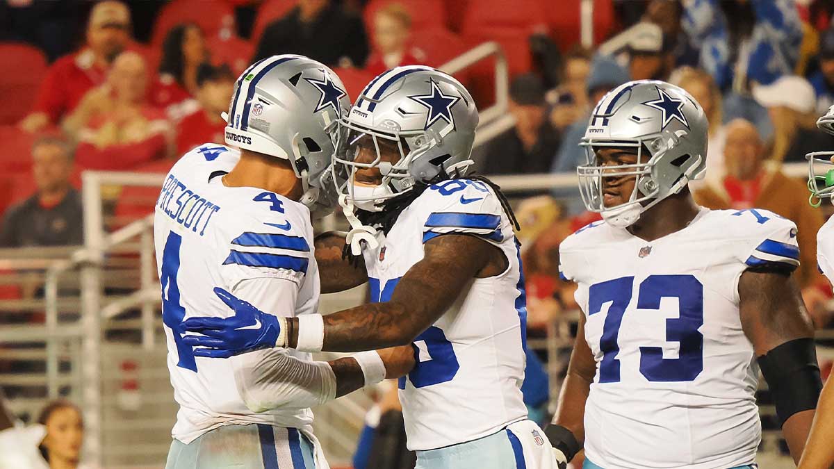 Dallas Cowboys quarterback Dak Prescott (4) celebrates with wide receiver CeeDee Lamb (88) after a touchdown against the San Francisco 49ers during the fourth quarter at Levi's Stadium.