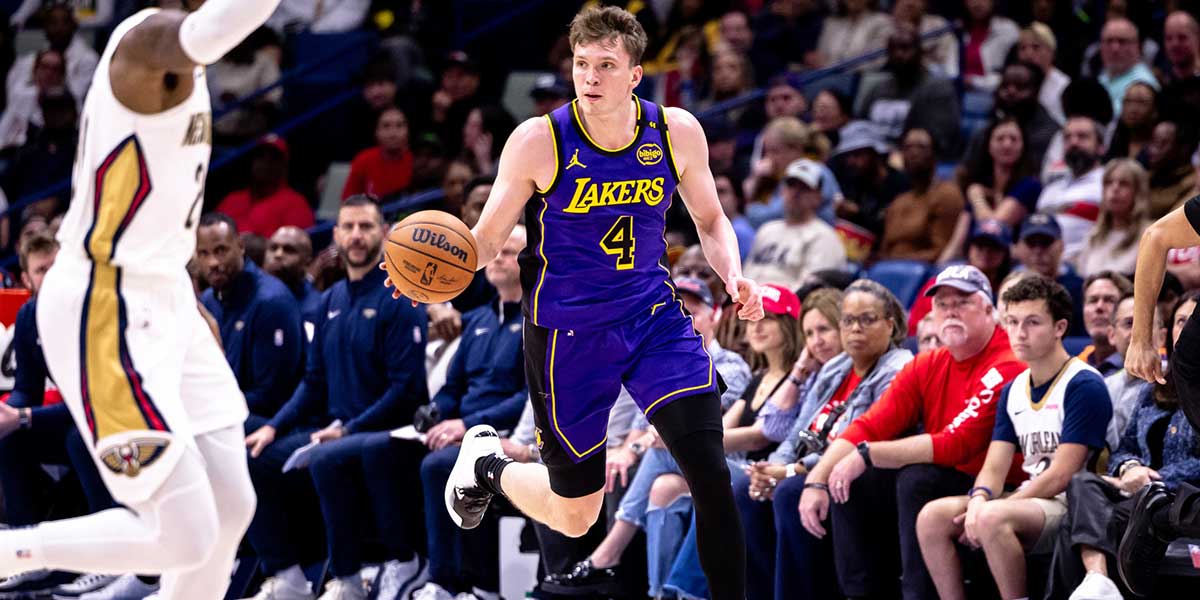 Los Angeles Lakers guard Dalton Knecht (4) brings the ball up court against the New Orleans Pelicans during the first half at Smoothie King Center.