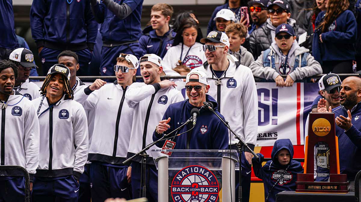 UConn Huskies head coach Dan Hurley speaks to a large crowd of fans outside the XL Center after the teams victory parade.